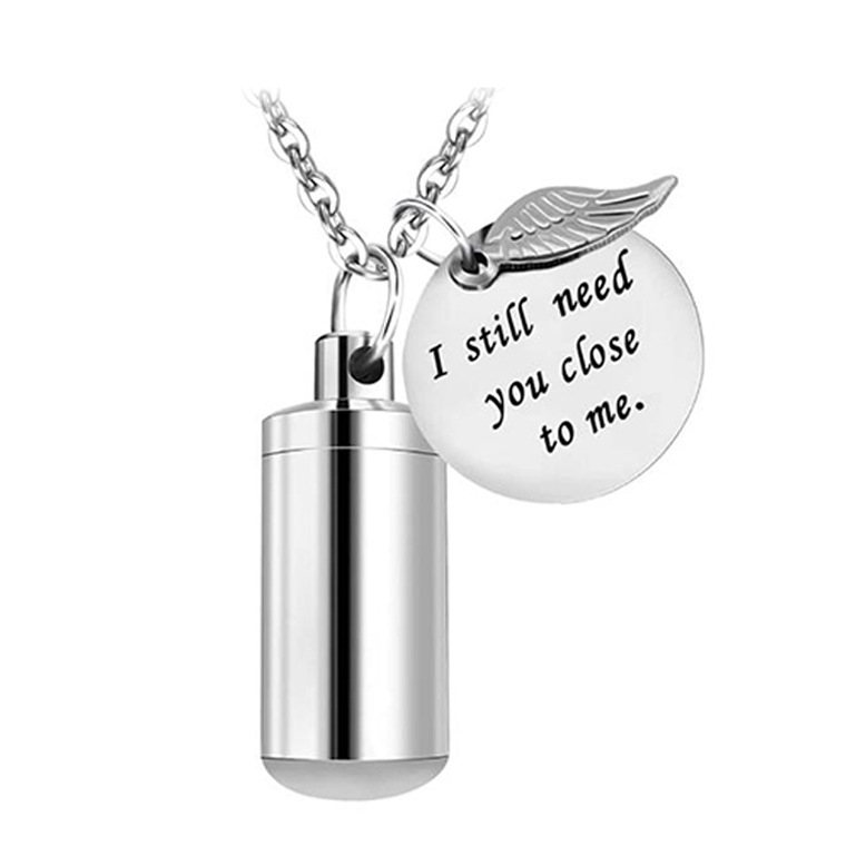 Amazon caliente venta conmemorativa de mascotas cenizas collar hombres y mujeres cilíndricas colgante alas de acero titanio plata colgante