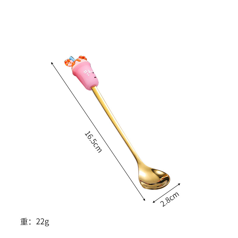 핑크 밀크티 컵과 스푼
