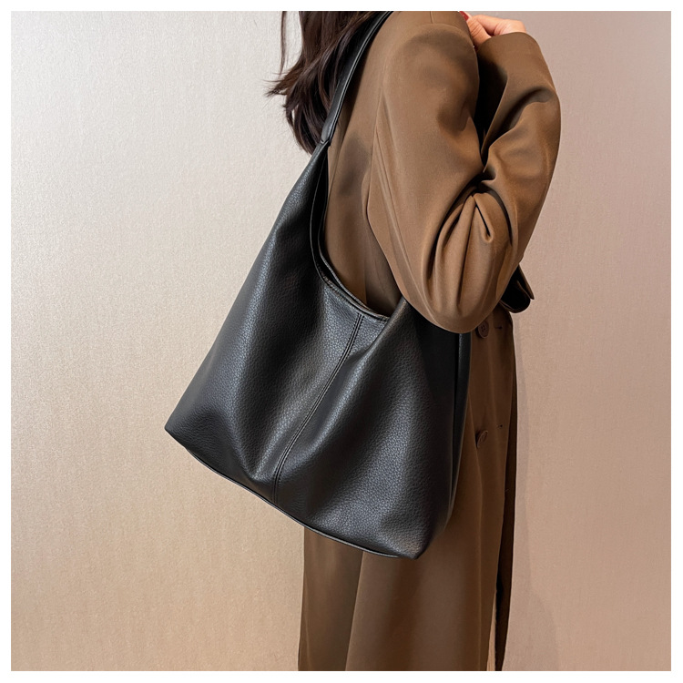 Bolsos de gran capacidad para mujeres primavera y verano 2025 nuevos bolsos de hombro de moda de alta calidad cubos de agua para niños y madres bolsa especial de cercanías