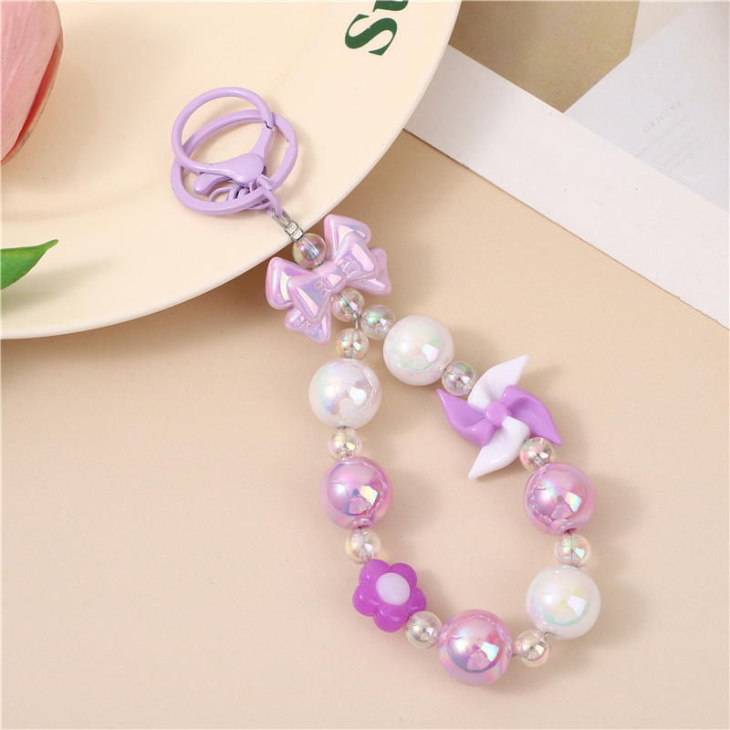 Japón y Corea del Sur color ins hecho a mano con cuentas flor llavero cordón de muñeca macaron color pétalo cordón de teléfono móvil en stock