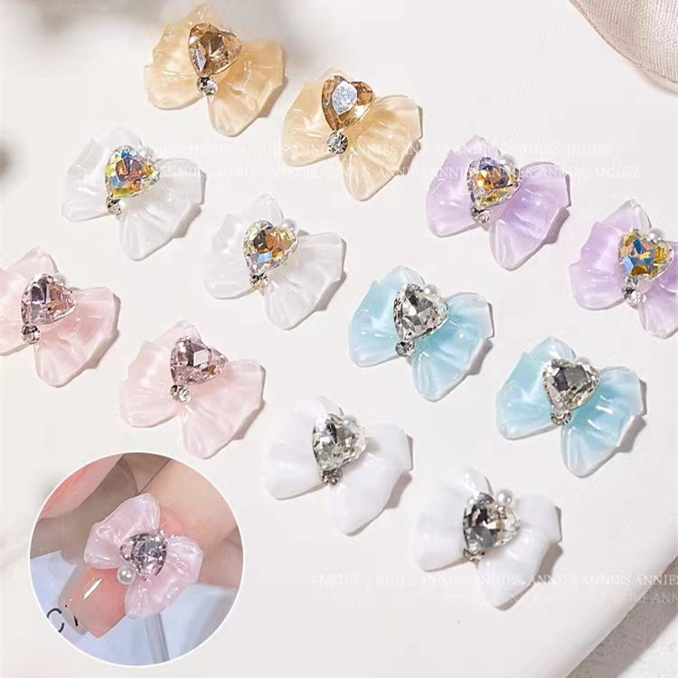 White nail decoration with bow