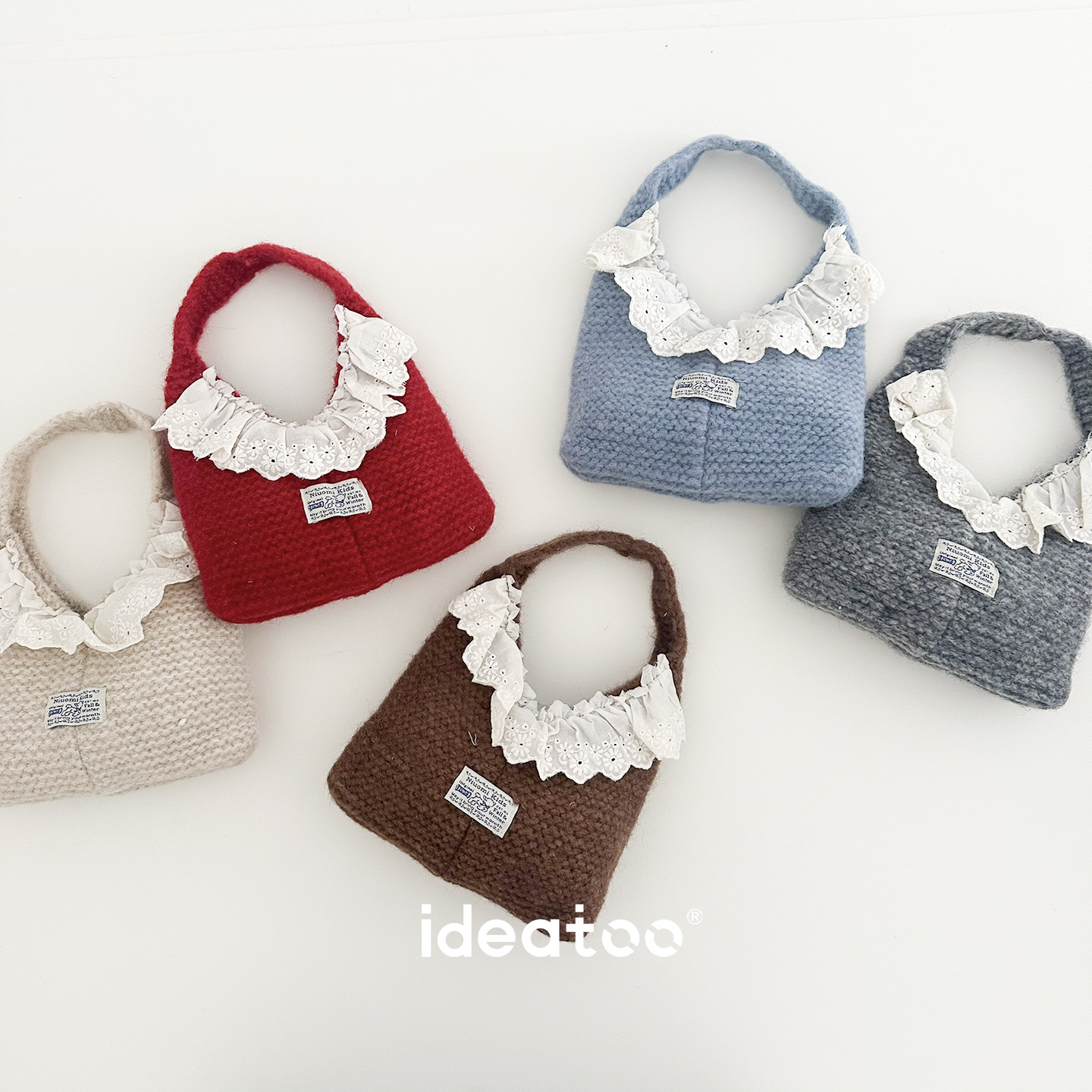 Children's autumn and winter knitted tote bag with lace trim and fabric label, featuring thick yarn weaving, a cute and mini design perfect for outings