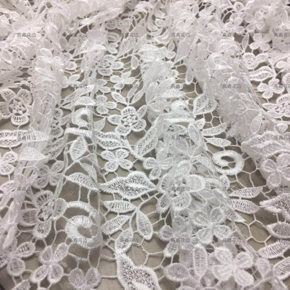 现货供应 新款优质小花水溶涤光牛奶丝花边 时尚女装刺绣花边辅料