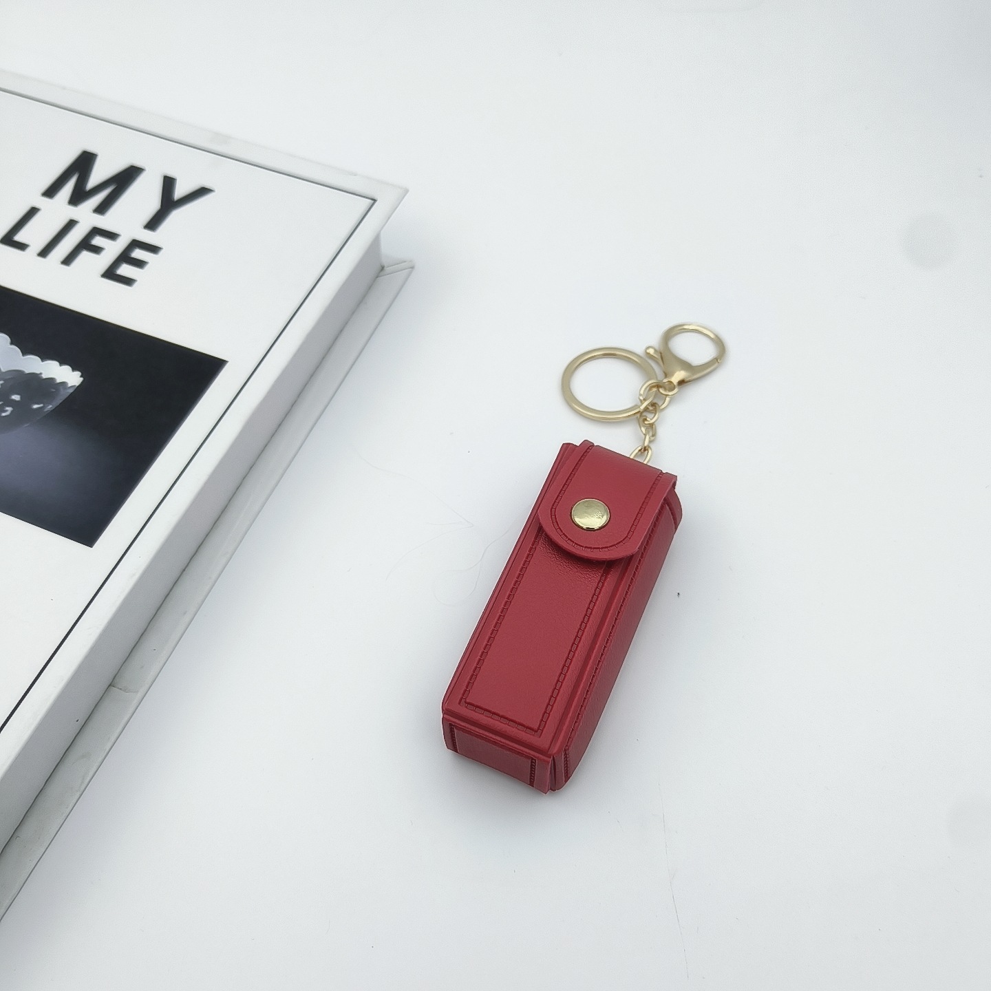 Bolso de cambio transfronterizo sobre rojo espejo creativo llavero colgante pequeño PU cuero bolso de coche accesorios accesorios en stock