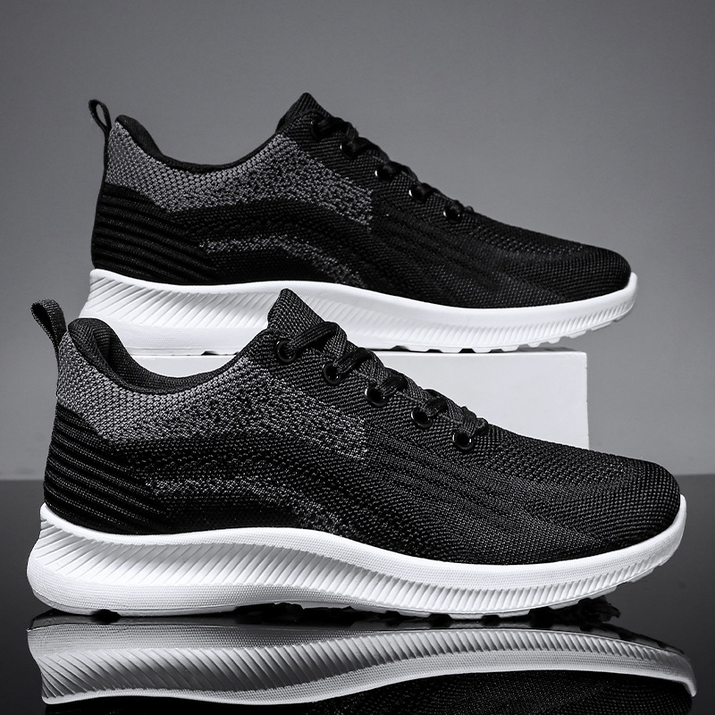 Zapatos de hombre 2024 primavera nuevos zapatos casuales de hombre volando tejido transpirable zapatos de una sola capa estilo coreano zapatillas de deporte con cordones fábrica al por mayor