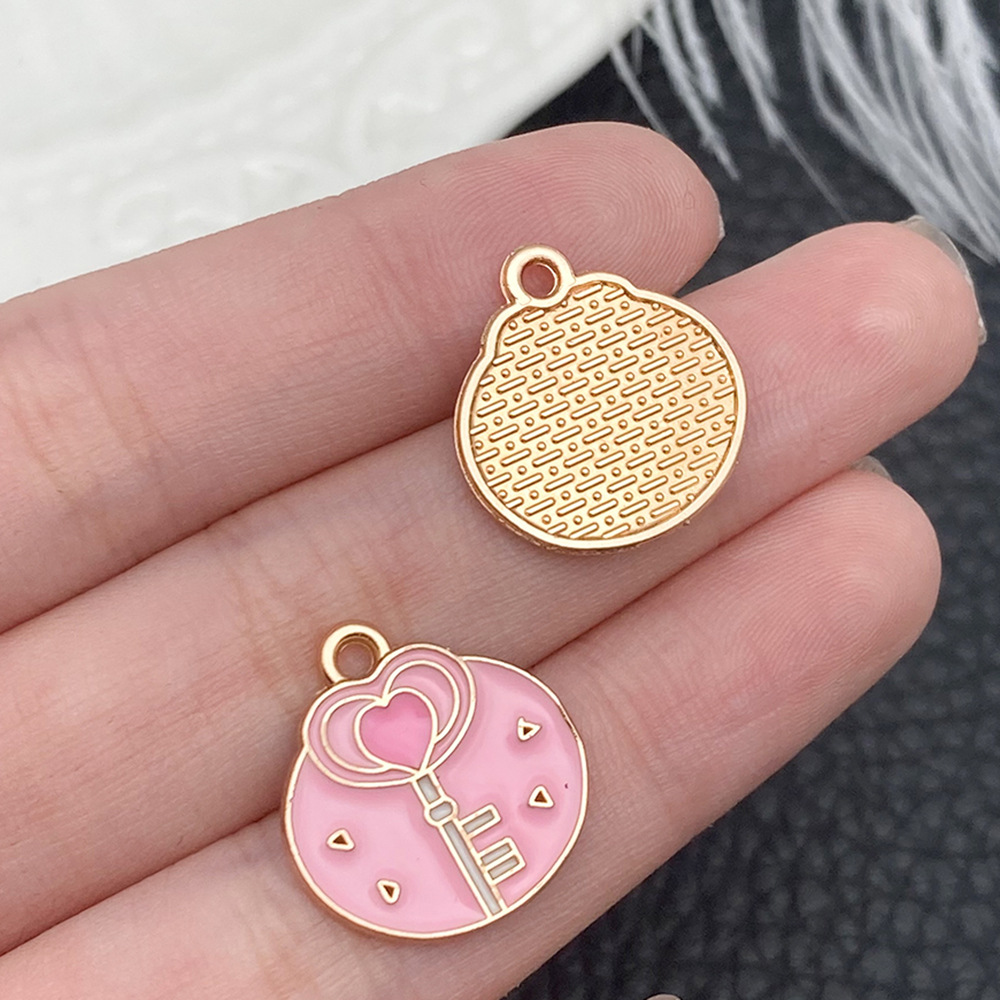 Una llave rosa goteante de aceite 18x17mm - 21115 - 1,1g