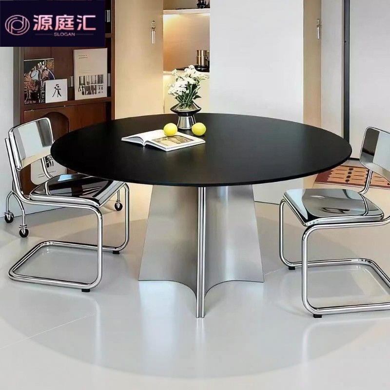 Nordic-style round dining table, high-end and stylish, with a sleek design, featuring a porcelain tabletop and stainless steel frame, perfect for small apartments