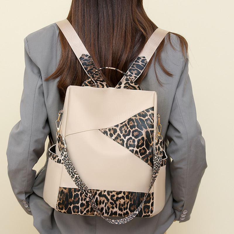 Nueva mochila con estampado de leopardo para mujer 2024 nueva mochila de viaje de todo fósforo de moda de gran capacidad mochila escolar para estudiantes de un solo hombro