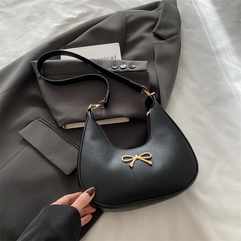 Sensación de la axila bolso pequeño mujer 2025 primavera nueva moda todo-fósforo bolso de hombro diseño de nicho bolso de palo francés mujer
