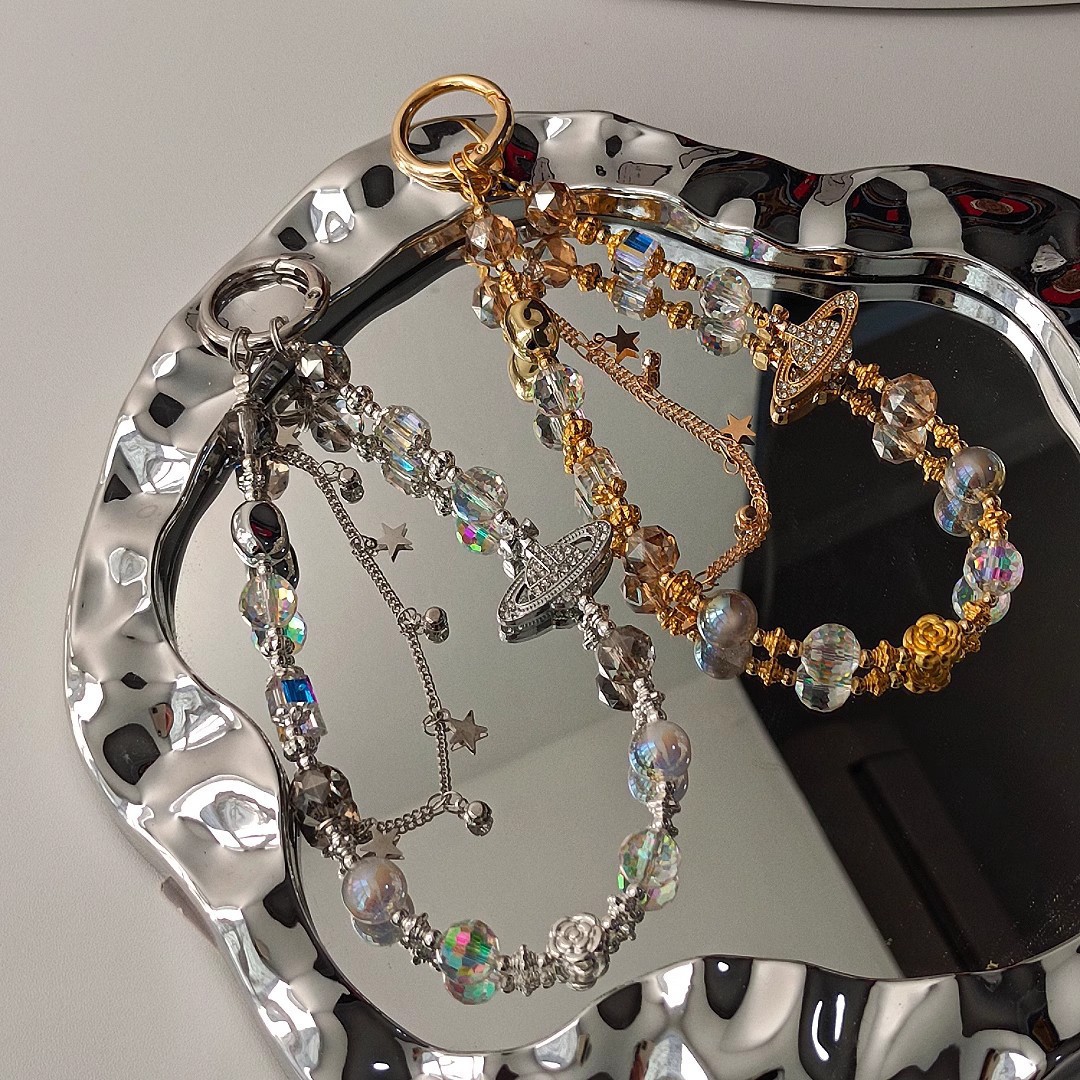 Cadenas de alta sensación de cuentas de cristal de Saturno parpadeante nuevo estilo chino bolso de cámara colgante corta cuerda de caso de teléfono móvil