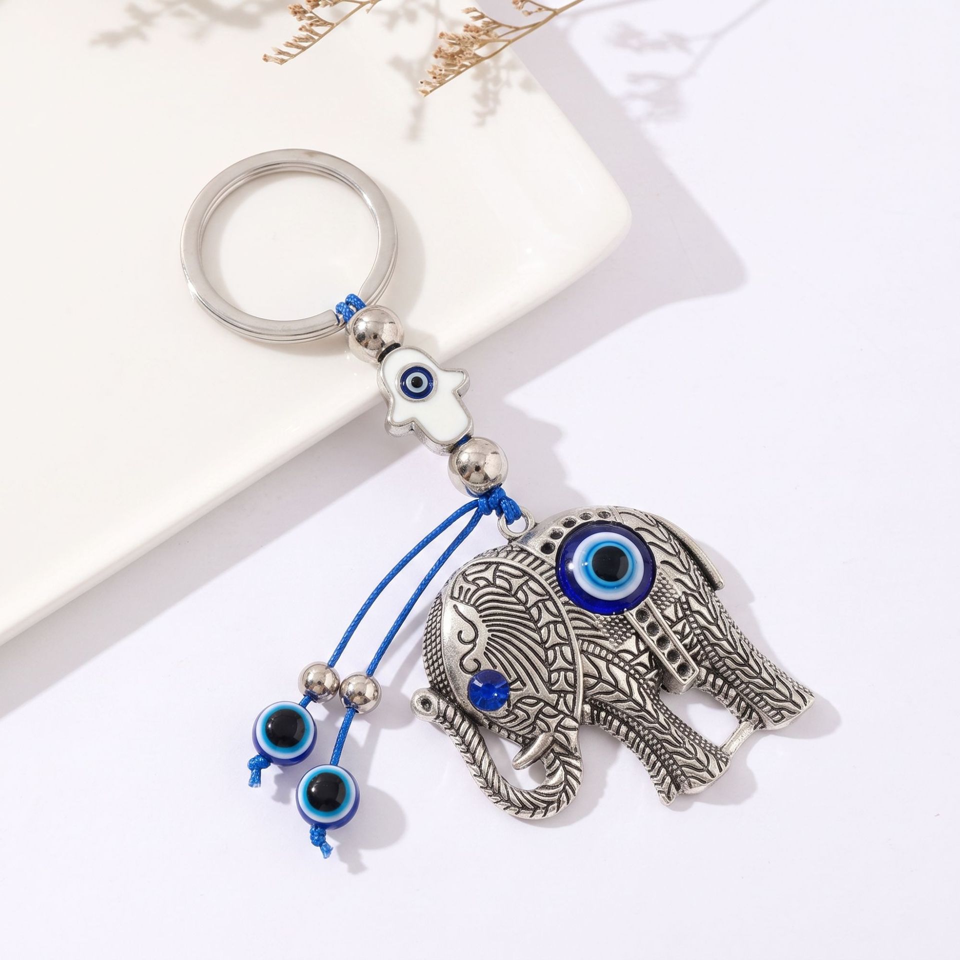Ojos del diablo creativos transfronterizos ojos azules elefante llaveros accesorios accesorios retro colgantes de aleación