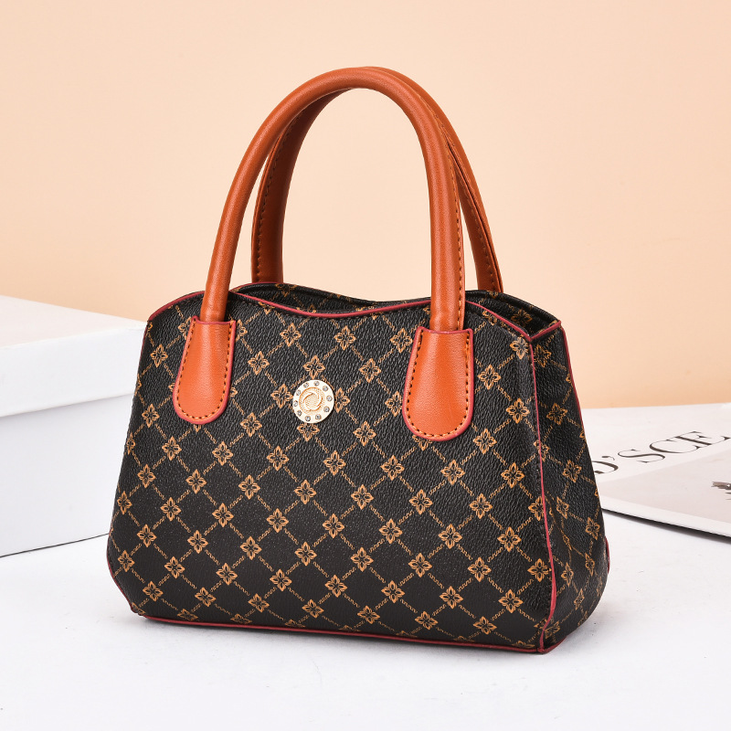 Nuova borsa di vendita calda Borsa di moda da donna Borsa semplice e casual per la mamma Borsa per la spesa versatile per la spesa di mezza età 2023_voghion.com