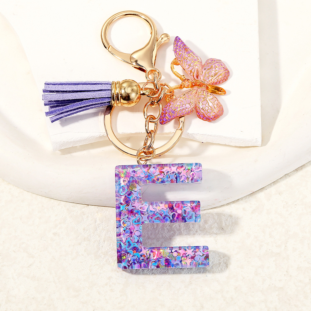 Mayorista transfronterizo mariposa esquinilla iniciales llavero de cristal goteo llavero de letras bolsos colgante