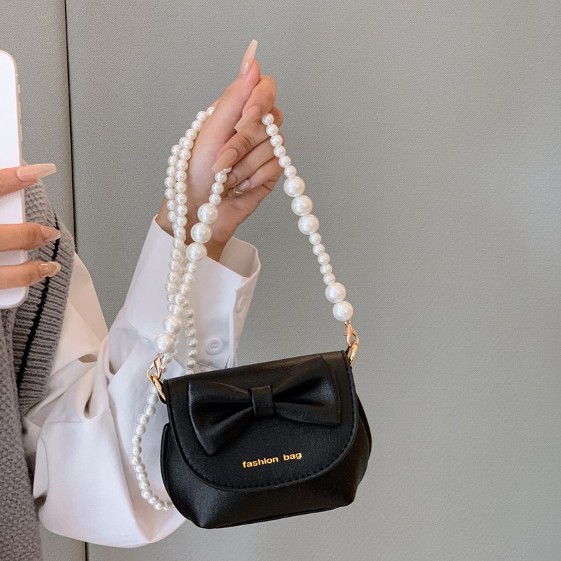 Cute mini niñas bolso de hombro dulce perla bolso de bebé coreano nuevo bolso de cambio de color sólido para niños