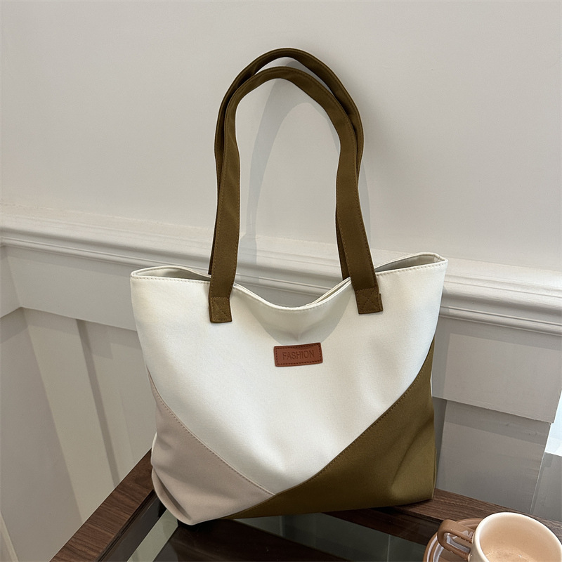 Bolsa de tela de gran capacidad para mujeres 2024 nuevo bolso de alta calidad nicho bolso de viaje bolso de hombro de moda