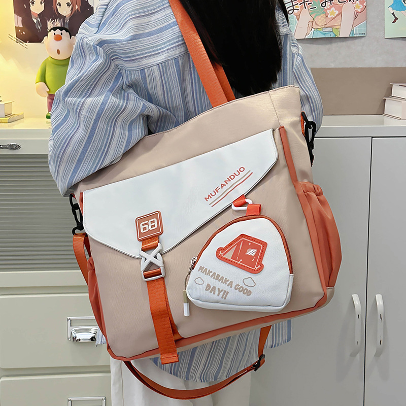 가방 크로스 바디 여자 올 매치 캔버스 가방 토트 백 고급 센스 크로스 바디 백 통증 가방 대학생 중학교 스쿨 백