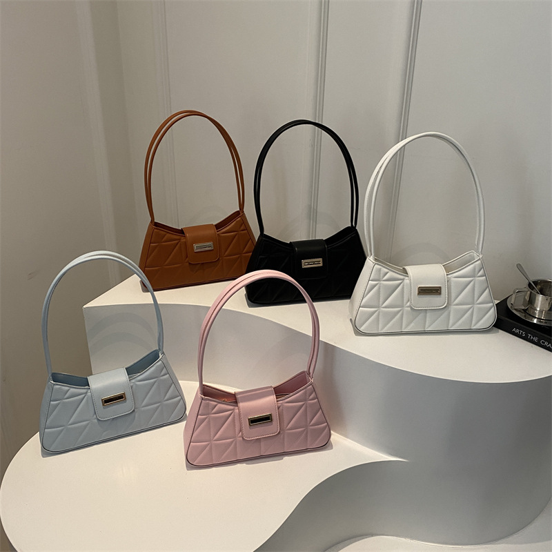 Bolso de nicho francés de textura occidental 2024 nuevo bolso femenino color sólido popular bandolera de hombro bolso de palo francés de axila