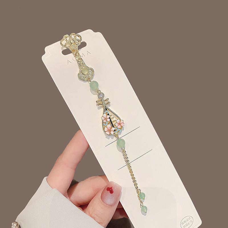 Broche estilo chinês com design de saia de cavalo e pipa borla_voghion.com