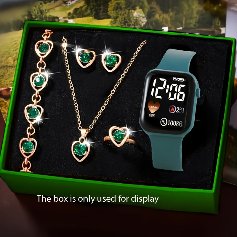Reloj verde + accesorios (sin caja)