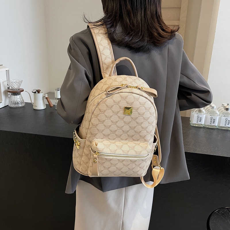 Mochila de estilo universitario de moda para mujeres 2025 nuevo viaje de viaje mochila de estudiantes adorable oso impresión mochila de moda