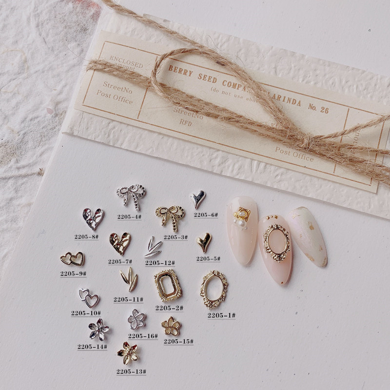 2022 new nail bow jewelry accessories metal alloy love jewelry three-dimensional simple flower leaves drill