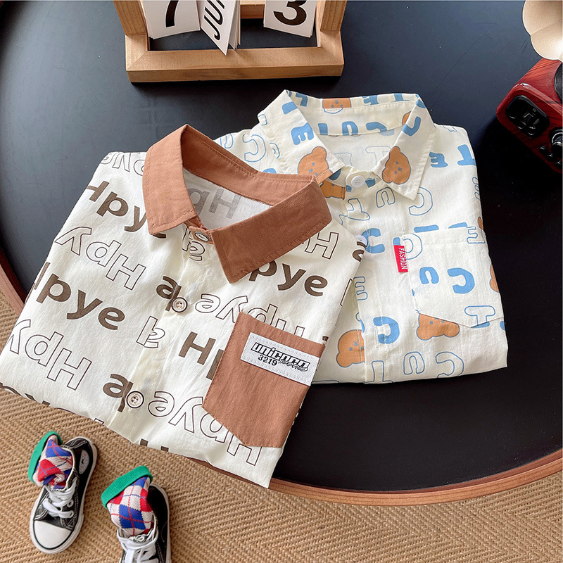 Camisa de manga larga para niños primavera nueva camisa de solapa de letras de dibujos animados para bebés camisa de punto chaqueta casual de otoño