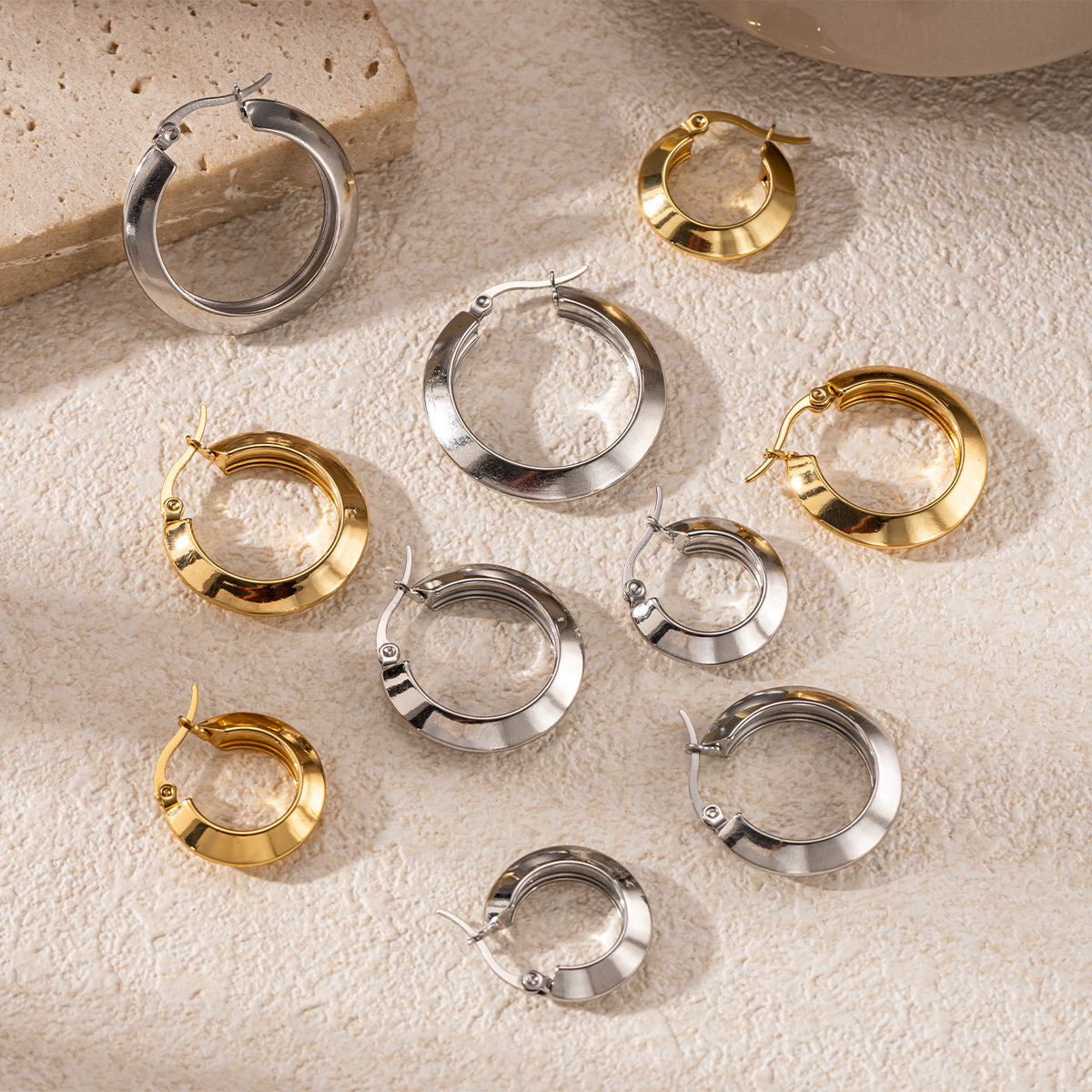 TENA europa y americana pendientes de acero inoxidable lujoso ligero de alto nivel de diseño versátil oro y plata pendientes de doble color joyería explosiva transfronteriza