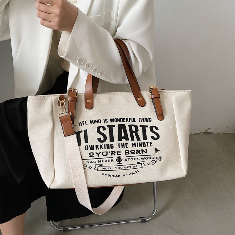 Bolso tote de lona estilo coreano 2025 con letras impresas, bolso de hombro cruzado, bolso tote versátil de gran capacidad.