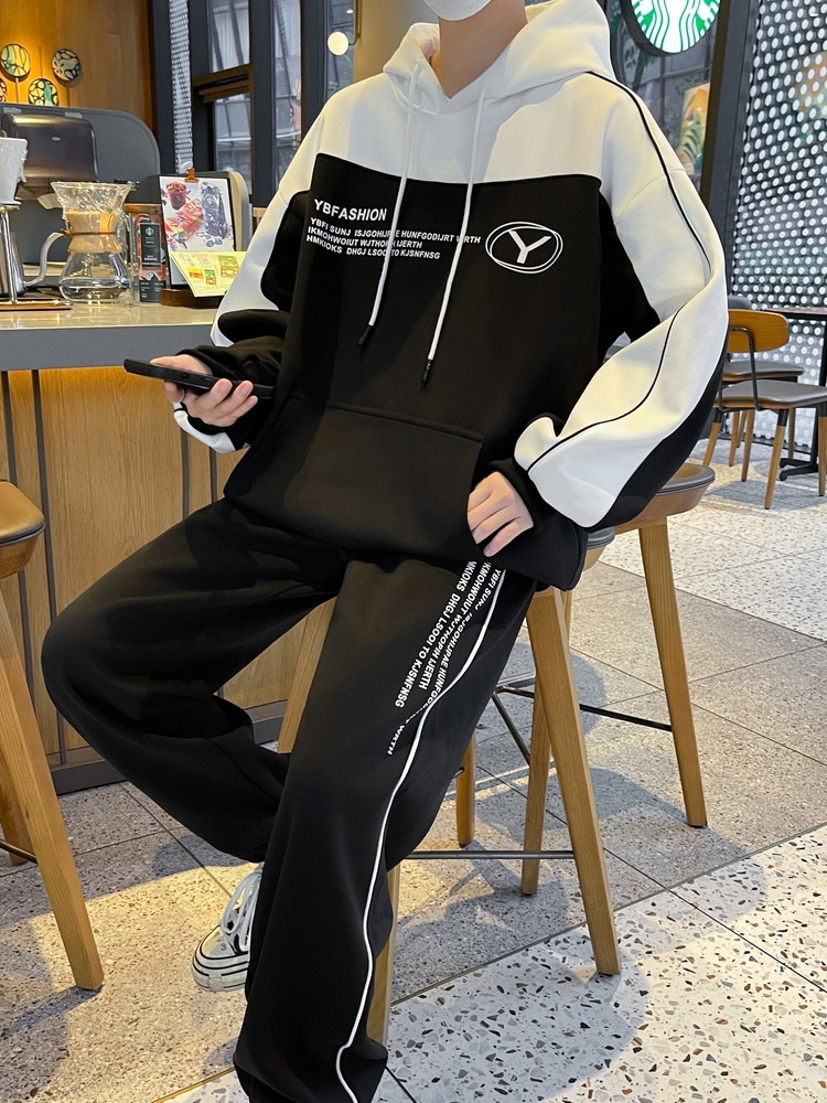 Otoño y invierno de hombre suelto encapuchado juego deportivo casual juvenil hombre con camiseta gruesa de dos piezas