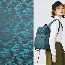 现货供应 全涤色织梭织迷彩提花布 平纹时尚箱包鞋帽休闲服装面料