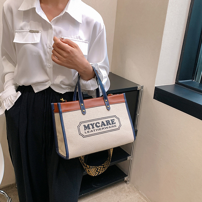 Bolso tote de gran capacidad, bolso de mano para clase y viajes, el popular bolso bandolera con estampado de letras de moda de este año.