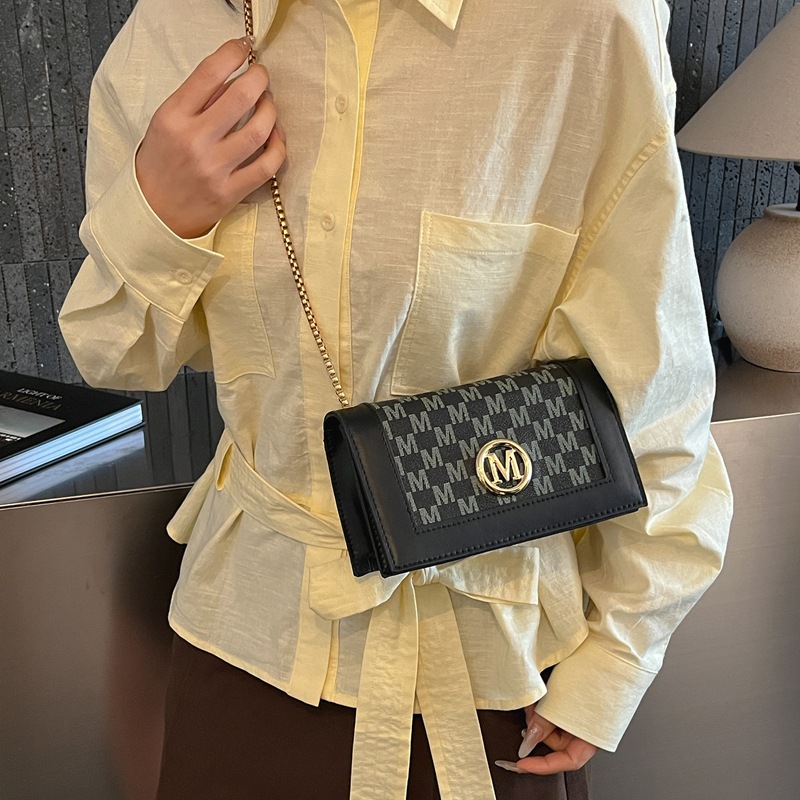 Europa y los Estados Unidos retro patrón pequeño bolso cuadrado mujer 2026 primavera nueva bolsa de cadena simple viaje mochila de hombro