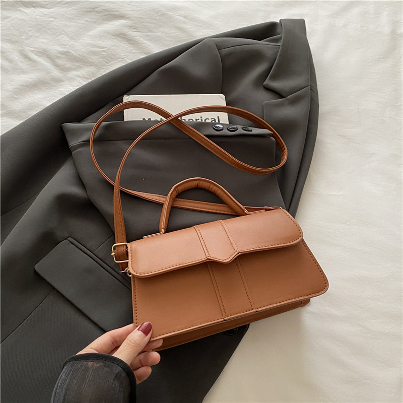 Bolso de color sólido de diseño de nicho para mujer 2025 nuevo bolso cuadrado portátil de moda de moda bolso de mensajero de alta gama de todo fósforo