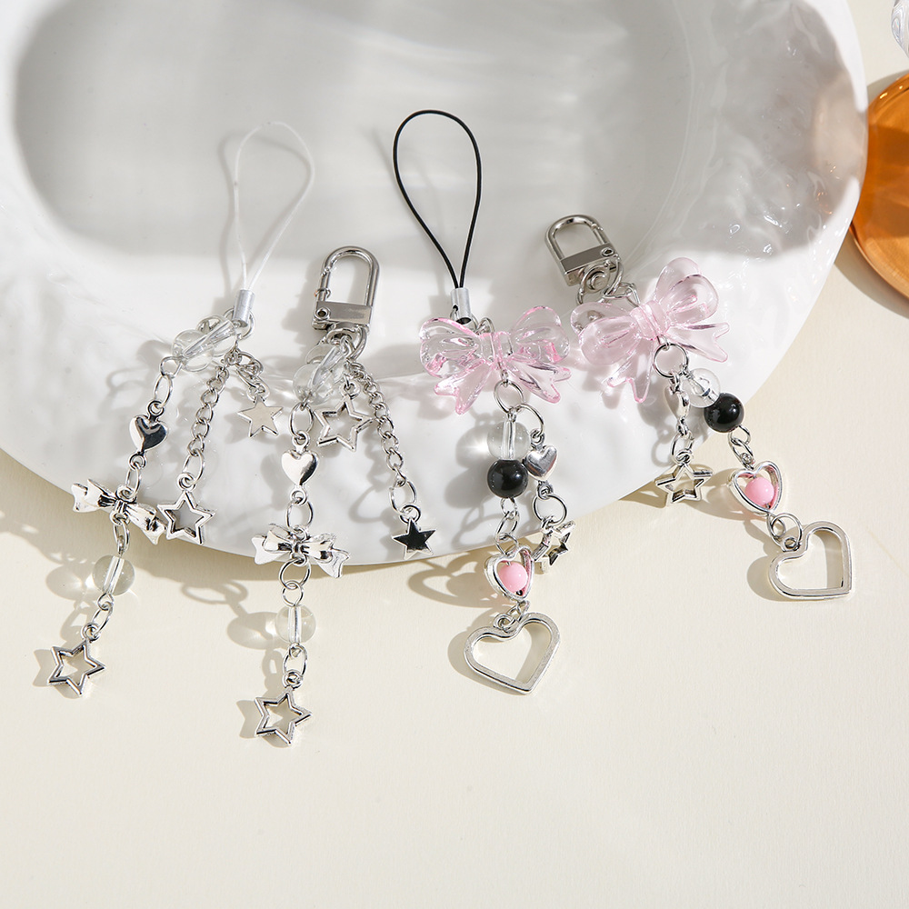 Nuevo estilo dulce Yafeng lazo llavero colgante creativo teléfono móvil cadena corta amor estrella de cinco puntas bolso decoración borla