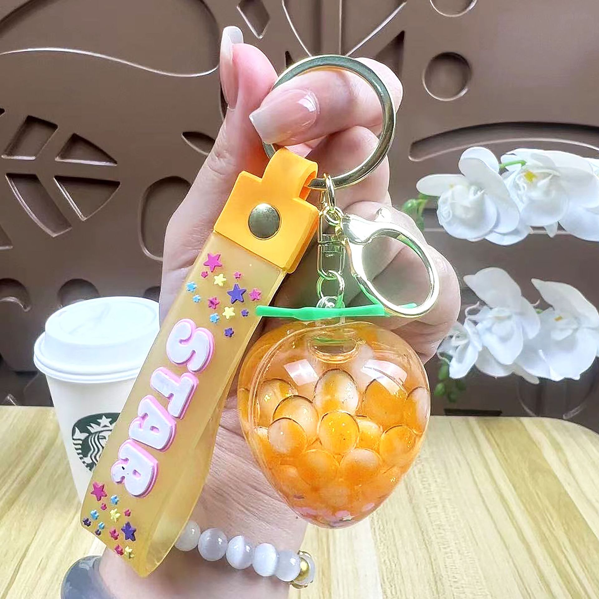 Perla leche taza de té oso colgante aceite flotante botella llavero femenino exquisito colgante mochila arenas movedizas colgante