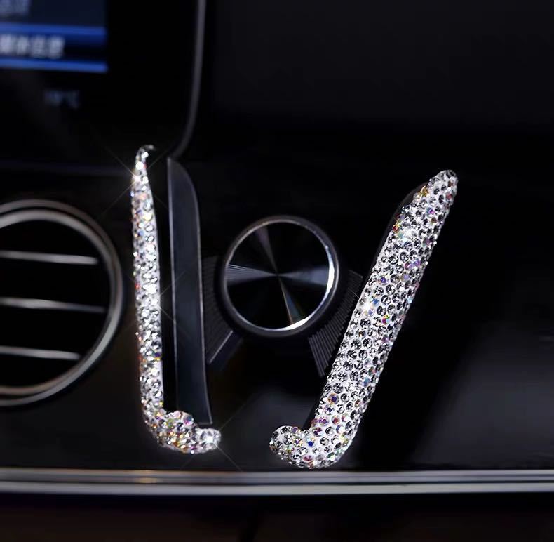 Cross-border car diamond-encrusted mobile phone bracket navigation rack dual-use air outlet seat gravity mobile phone bracket female bracket