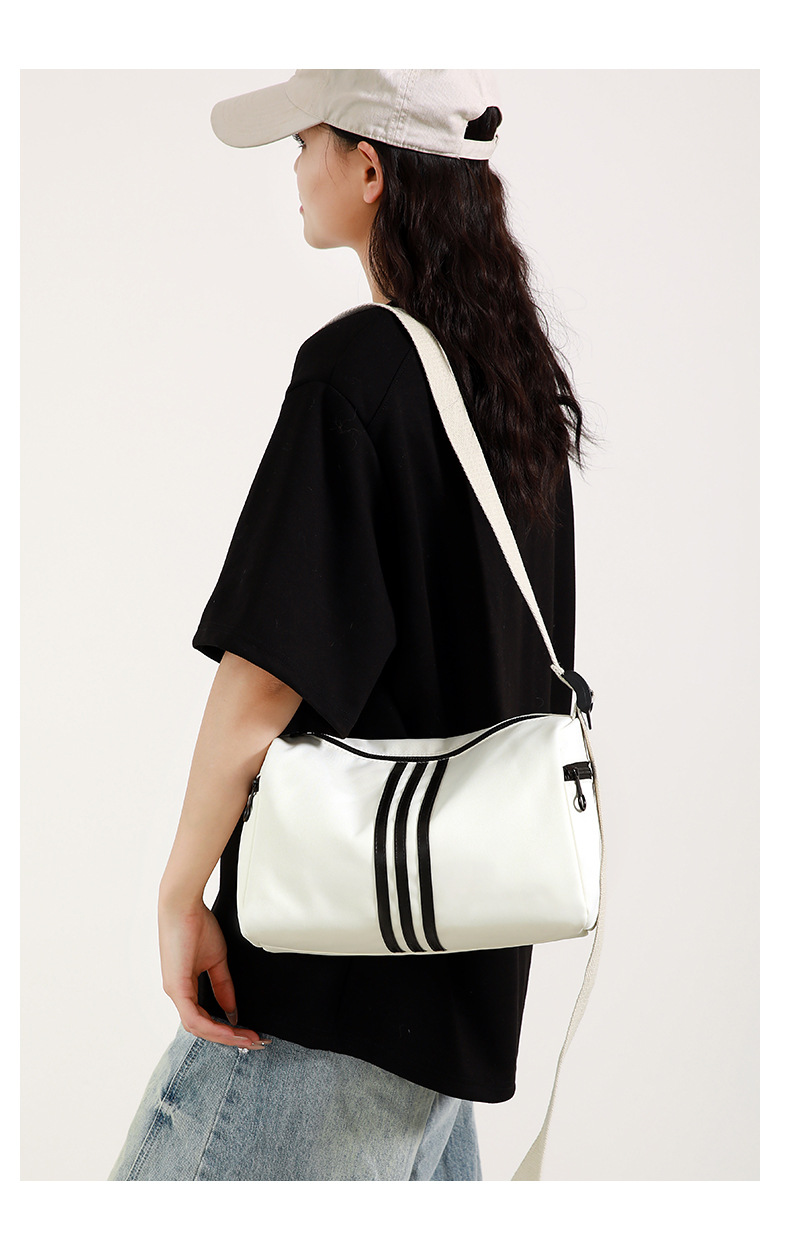 This is a simple, fashionable, casual and versatile crossbody bag for women, suitable for commuting. It is a large-capacity striped single-shoulder bag for both men and women undefined