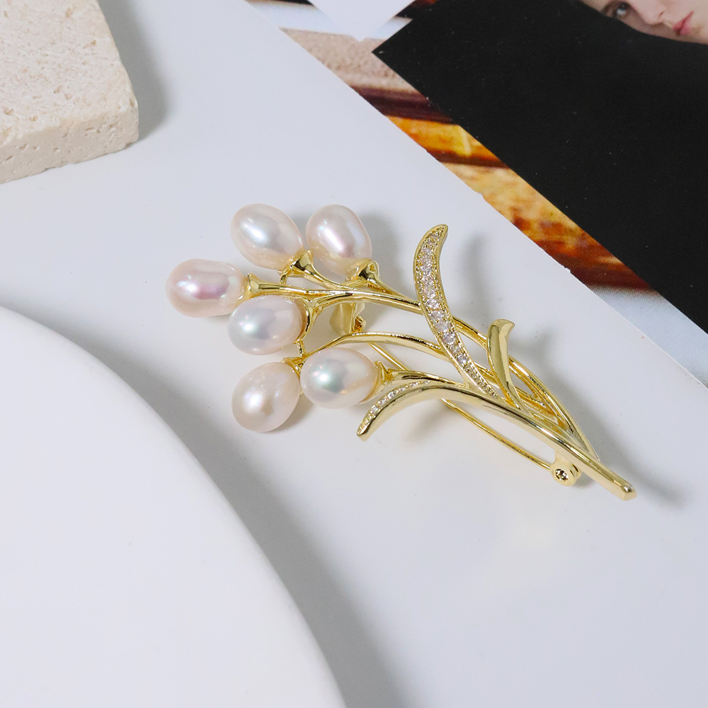 Nuevo globo original broche de perla de trigo de alta calidad nicho de diseño femenino broche coreano ligero de lujo pecho de moda