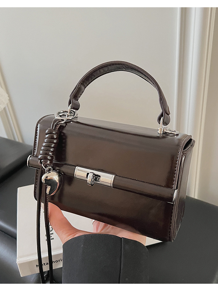 Bolso de mano de alta sensación para mujeres 2026 nuevo bolso cuadrado ligero de textura de lujo estilo coreano nicho bolso de hombro de mujer