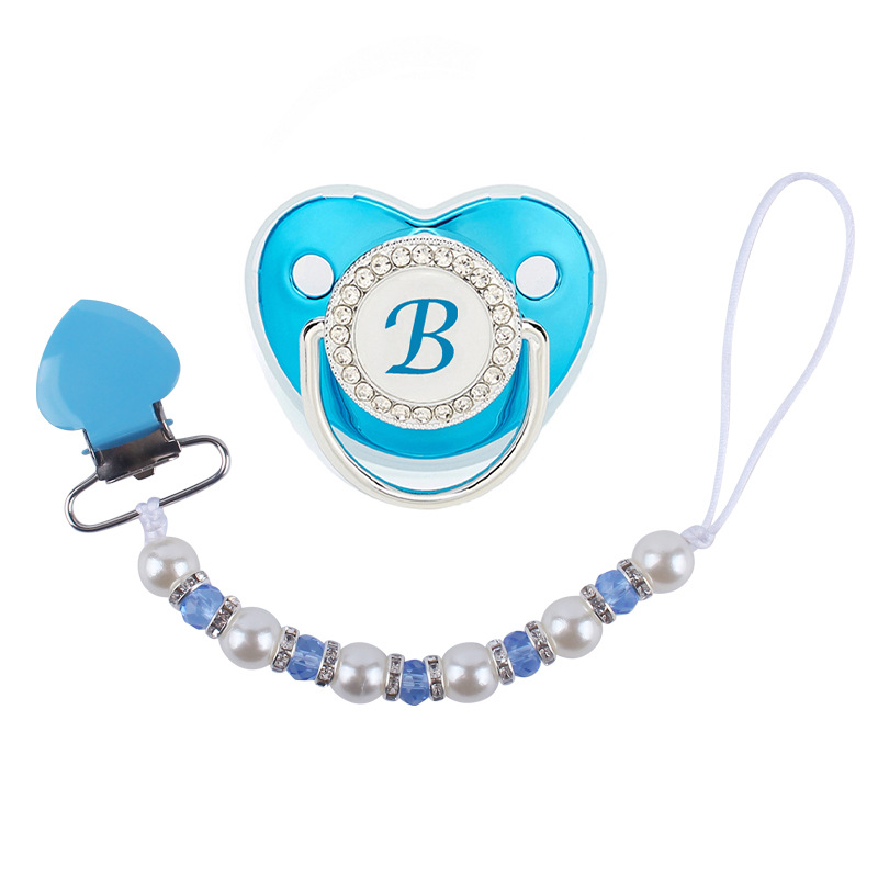 Nuevo bebé suministros melocotón corazón clip de hierro calmante bebé perla cristal chupete cadena anti-gota cadena chupete traje
