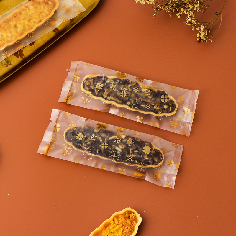 Clásico tipo barco de arroz glutinoso embalaje rectangular máquina de hornear bolsa de sellado en stock fábrica al por mayor bolsa de embalaje de piruletas