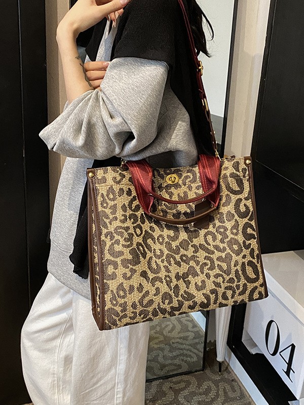 Bolso de patrón leopardo para mujeres 2026 nueva moda retro transfronteriza bolsa de viaje bolsa de tela de bloqueo mochila de hombro