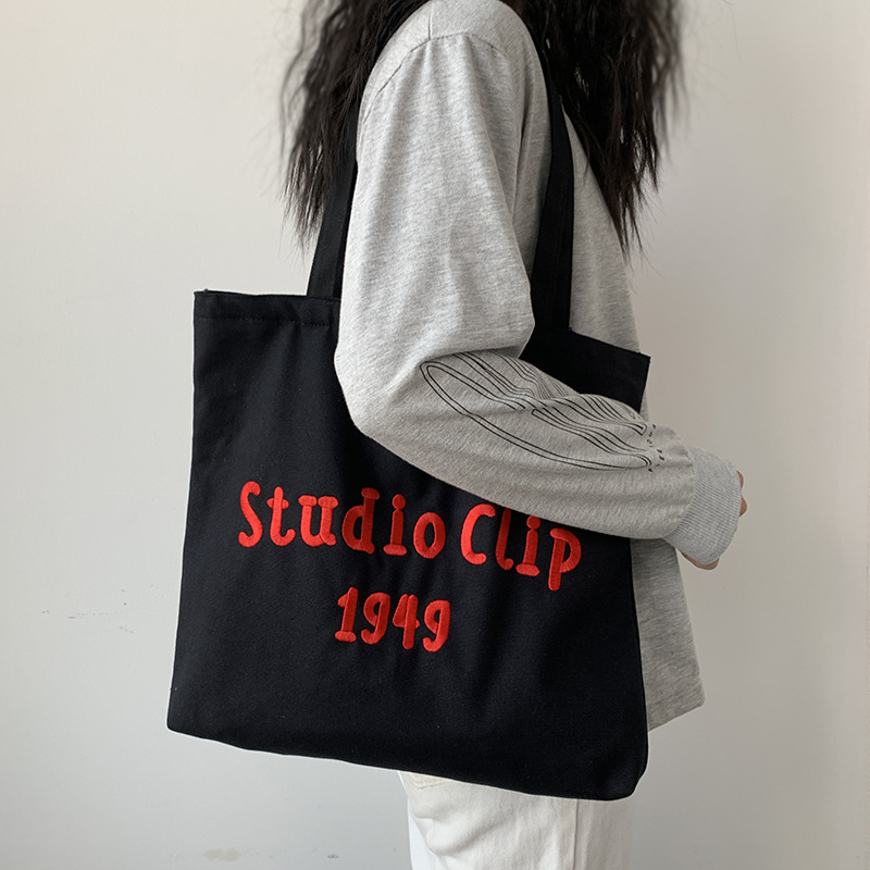 Estilo chino bordado bolsa de lona de los hombres femeninos de hombro nicho original simple letras artísticas de gran capacidad bolso de escuela del estudiante