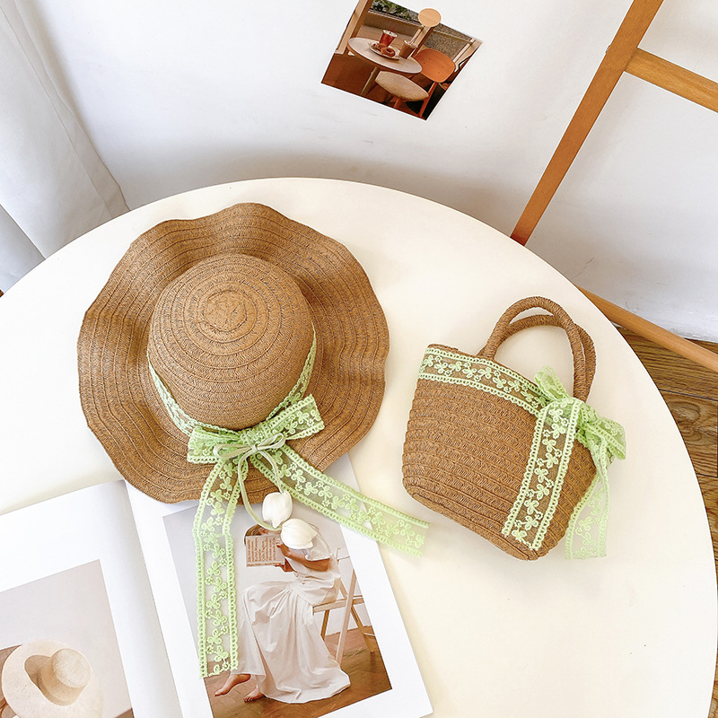 Nicho popular estilo coreano tulipán arco de papilla para niñas sombrero de paja paquete de bolsas pequeñas frescas dulces gorras de protección solar