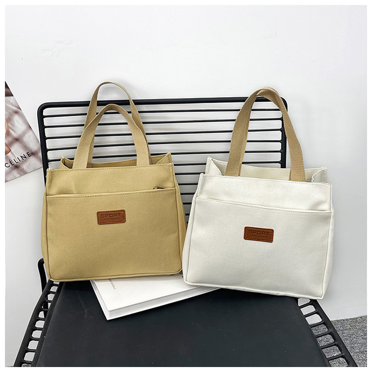 New wholesale fashionable and high-quality canvas handbag, simple and portable, easy to carry for going out, versatile lunch box and bento bag undefined