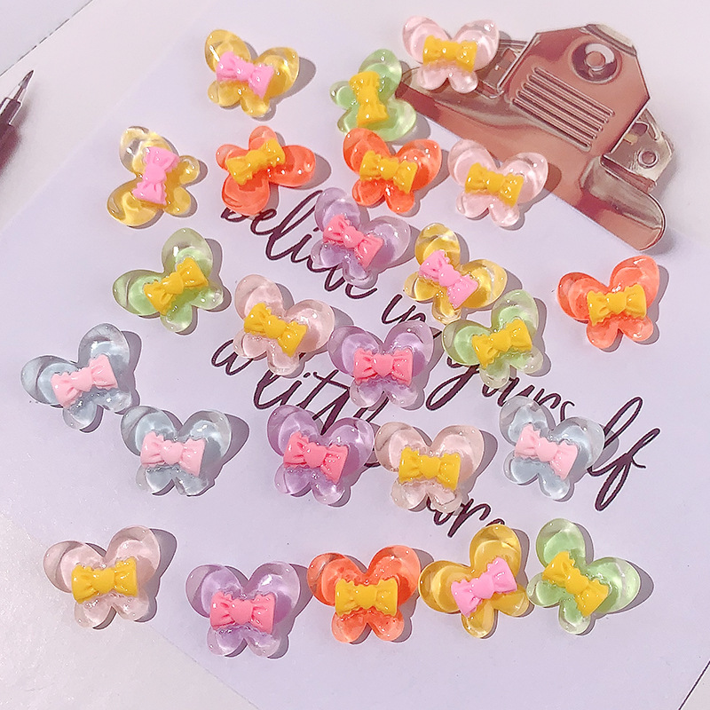 Nuevo color transparente mariposa arco DIY accesorios de resina pegamento crema caja de teléfono móvil adornamiento de pelo agujero material de parche de zapatos agujero