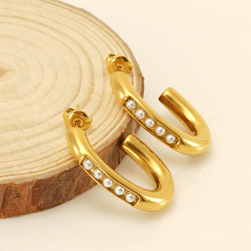 INS estilo francés estilo de alta calidad de acero inoxidable pendientes femeninos europeos y americanos 18K pendientes de perlas con incrustaciones de acero de titanio pendientes al por mayor