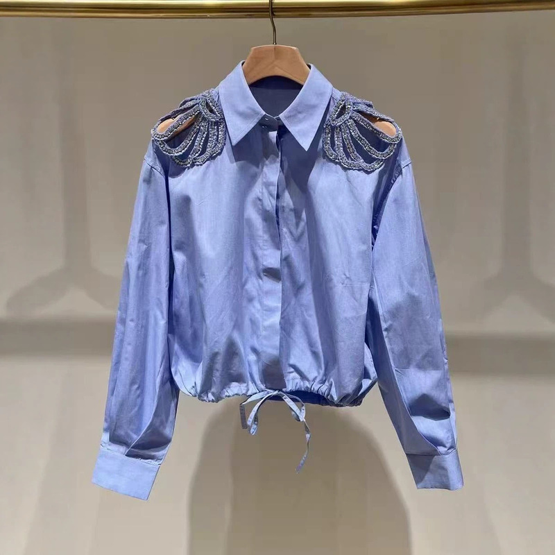 French-Style Niche 2026 Spring/Summer Blue Long-Sleeve Shirt with Shoulder Cutouts, Rhinestones, Drawstring Waist, and Turn-Down Collar French-Style Niche 2026 Spring/Summer Blue Long-Sleeve Shirt with Shoulder Cutouts, Rhinestones, Drawstring Waist, and Turn-Down Collar
