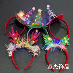 クリスマスの光る鹿の角の新型のネットのカチューシャのヘラジカのサンタクロースの帽子のカチューシャは明かりの鹿の角の髪飾りの卸売りを持ちます。