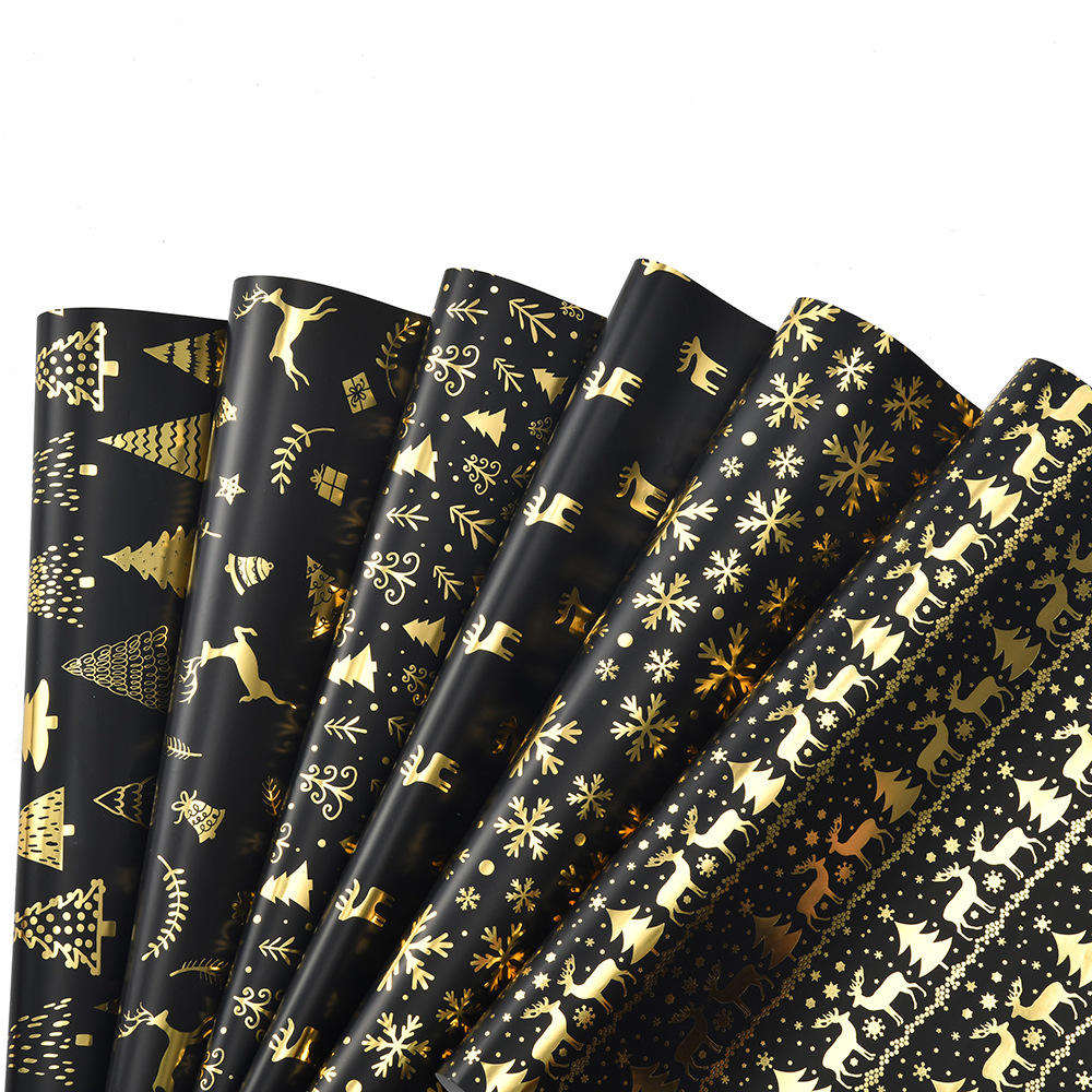 Nuevo papel de embalaje de Navidad estampado retro oro negro alce copo de nieve regalos de árbol de Navidad papel de regalo al por mayor